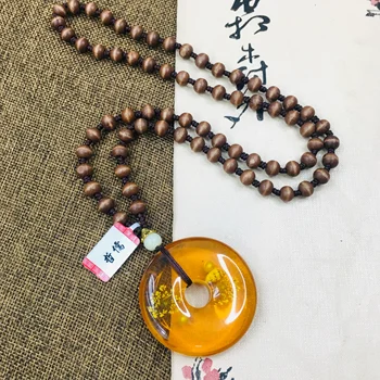 

Zhe Ru natural beeswax amber light flower donut pendant with wooden bead necklace men and women sweater chain