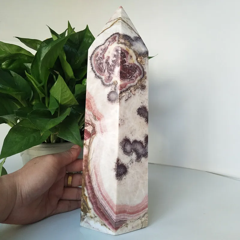 

A Oversized stone wand point natural rhododendron crystal decorated obelisk and hexagonal crystal point healing crystals