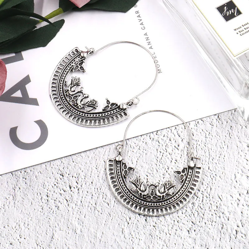 

European and American popular peacock pattern geometric hollowed-out round ear buckle pendant alloy earrings female