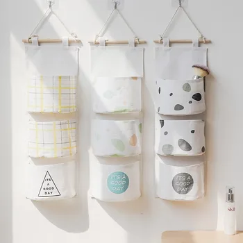

Cotton linen storage bag hanging Nordic small fresh three-dimensional three-pocket hanging dormitory wall storage bag