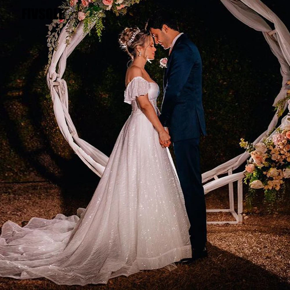 

Платье Свадебное ТРАПЕЦИЕВИДНОЕ из блестящего тюля с открытыми плечами и рукавами со шлейфом