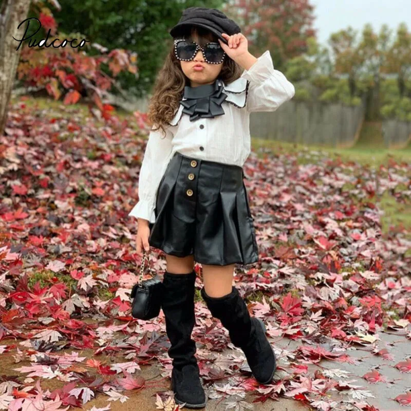 

Pudcoco 2PCS Toddler Kids Girl Clothes Set Autumn Long Flare Sleeve Tassel Blouse Tops + PU Leather Shorts Outfit Child Suit