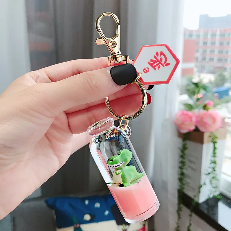 

Creative Milk Bottle Key Chain Quicksand Keychain Liquid Floating Dinosaur Keyring Backpack Drifting Bottle Gift for women K081