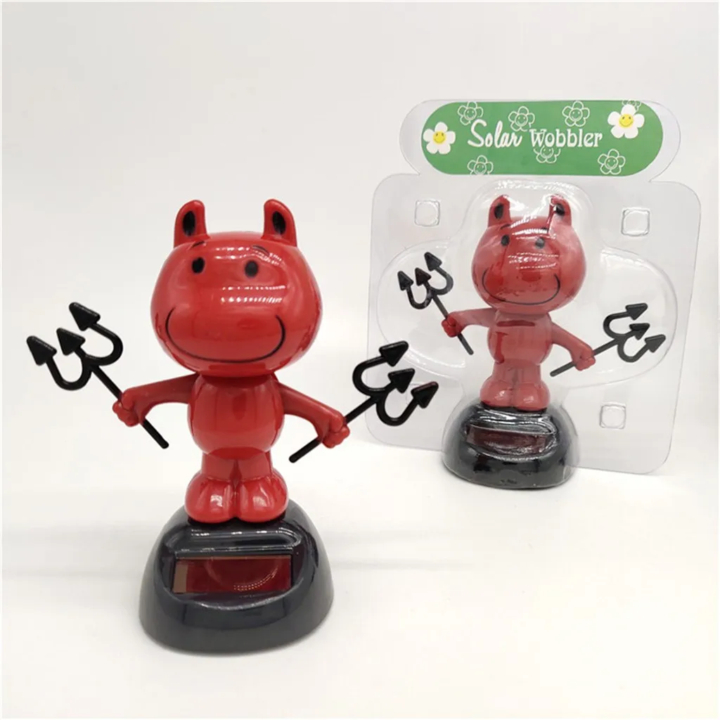 cow with toy car on head