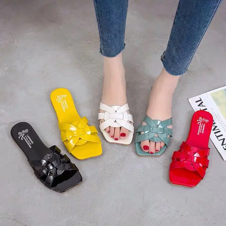 

Slippers female summer wear tide net red roman fashion wild flat bottom beach shoes flat with a word drag