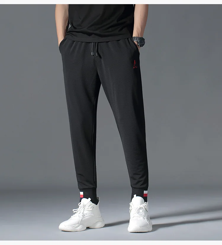 Autumn Black Hollow Out Mens Pants Loose Drawstring Sports Pants Streetwear Fashion Designer Joggers Calca Masculina