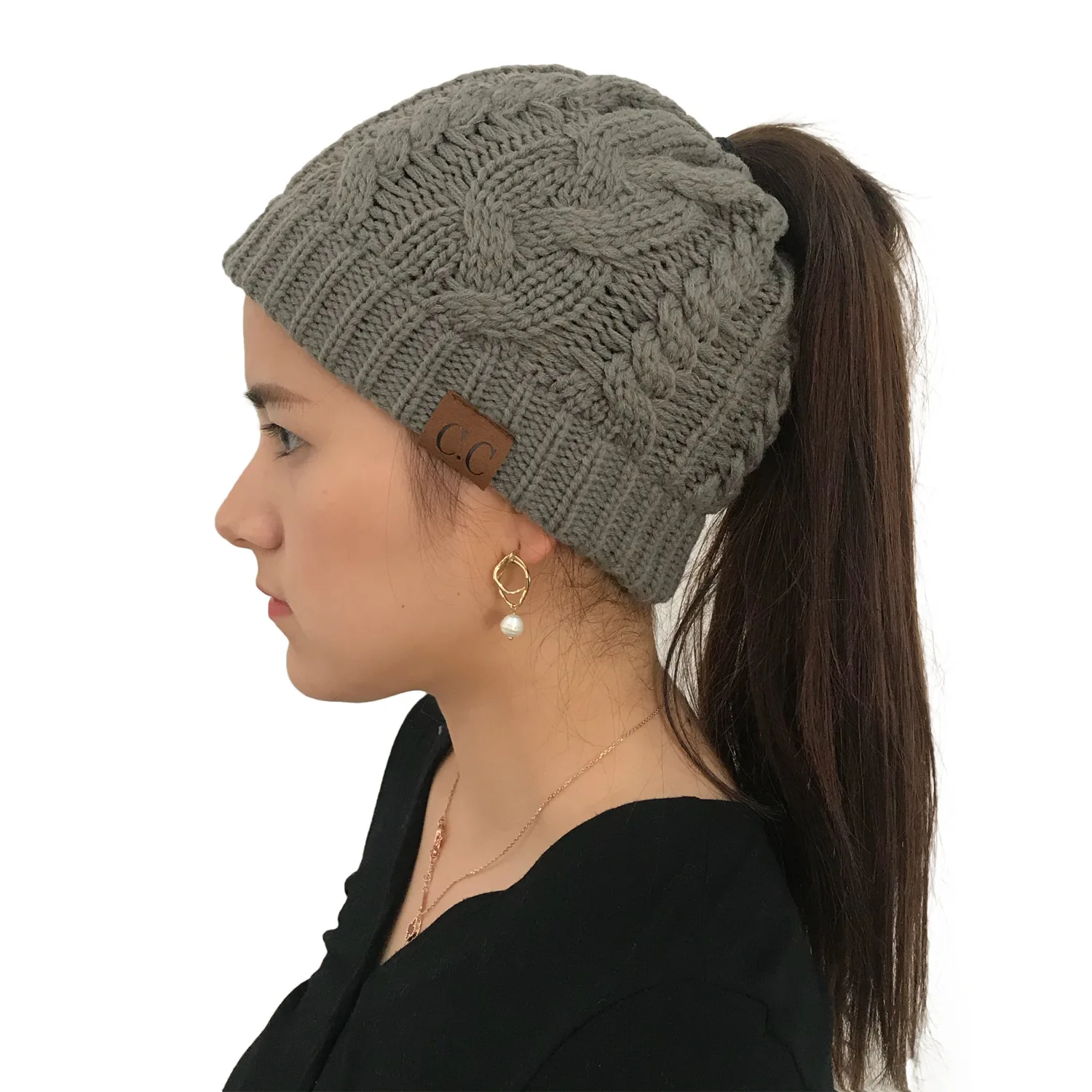 European and American autumn and winter hats pop-up twist knitted ponytail hat lady's woolen hat