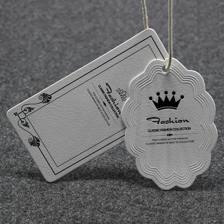 

New fashion customized high quality 600gsm white paper embressed tags, OEM high-grade garment labels tags