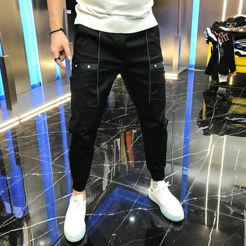 

Men's new autumn 2020 pants fashion solid color personalized rivets mid waist lace up handsome casual pants Leggings fashion men