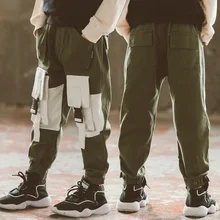 В году, новые осенние повседневные детские штаны в Корейском стиле средний и большой размер Комбинезон для мальчика с круглой сумкой