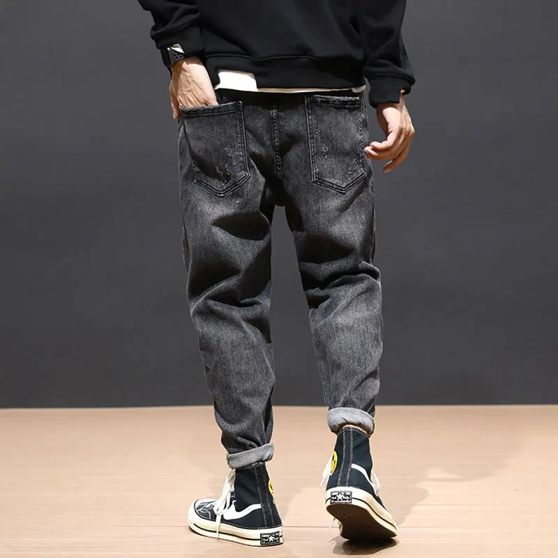 Flash Sale Fashion Streetwear Men Jeans Loose Fit Black Gray Harem Pants High Quality Korean Style Hip Hop Ripped Jeans Men Pencil Pants