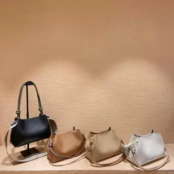 

New high quality leather fashion versatile trend personalized straddle bag shoulder bag armpit bag women's bag