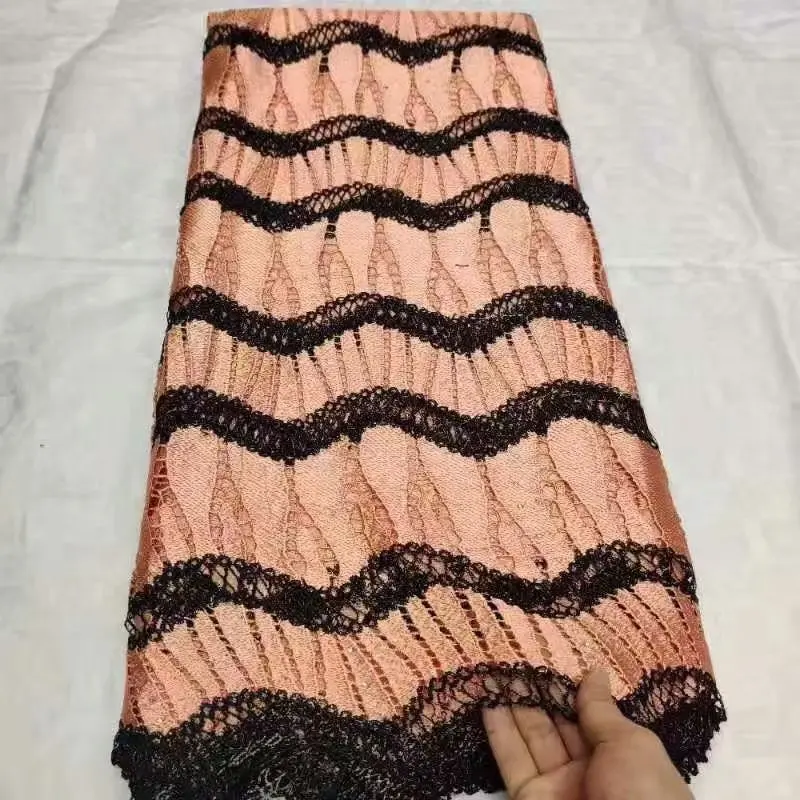 Все еще летают последние нигерийские водорастворимые кружевные ткани Tissu