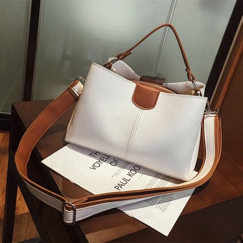 

Women's handbags new European American slung women's handbags fashion commuter bucket bag shoulder solid color portable bags