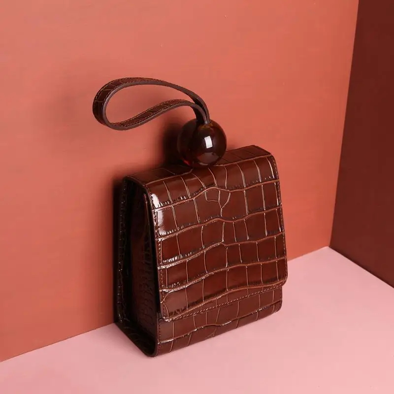 

Spring 2020 new style leather round bead female bag solid color shoulder portable messenger small square bag crocodile pattern
