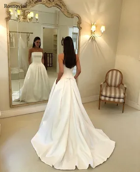

Arabic Cheap Wedding Dresses With Pockets 2019 Strapless Backless Sweep Train Bow Modest Garden Beach Stain Bridal Gowns Custom