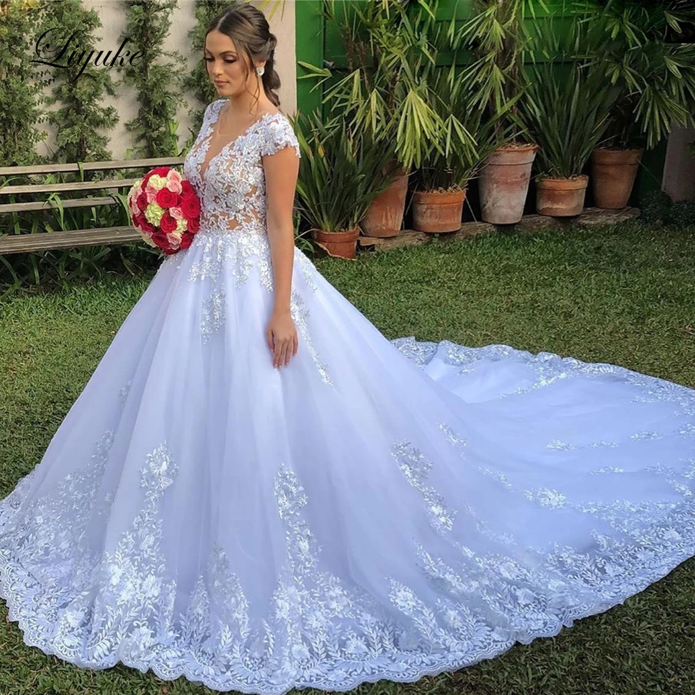 

Liyuke Stunning Off White A Line Wedding Dress With Rhinestones Cap Sleeve Gorgeous Bridal Dress