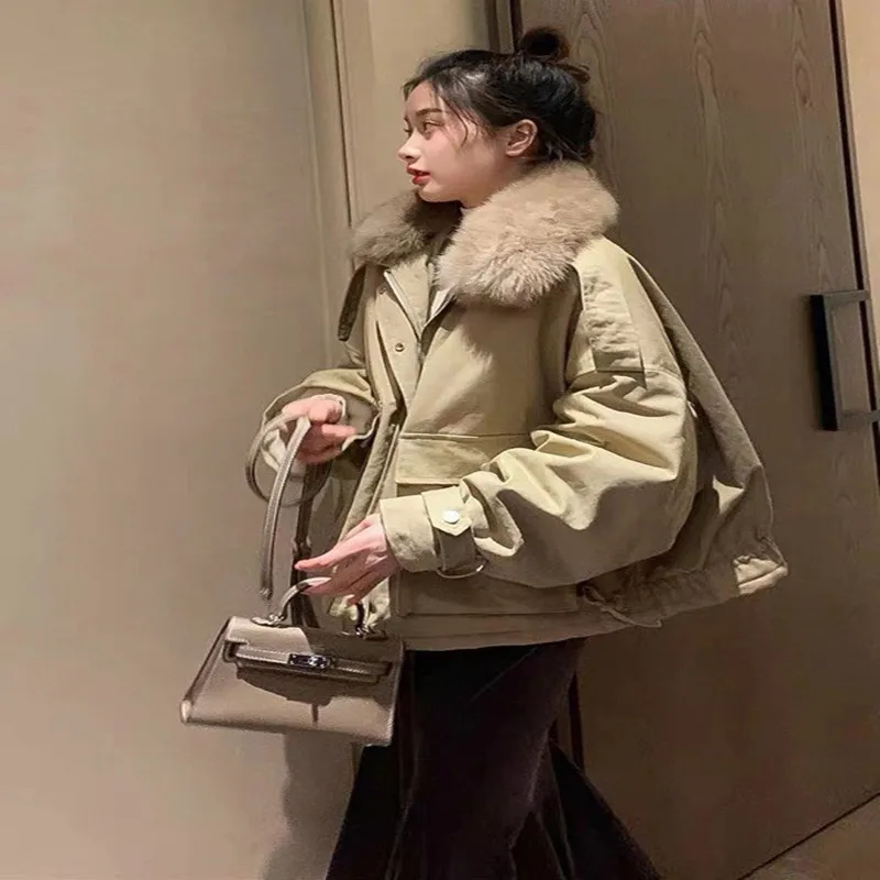 

2020 winter women's down jacket tooling fox fur collar thickened warmth fashion 90% white duck down jacket