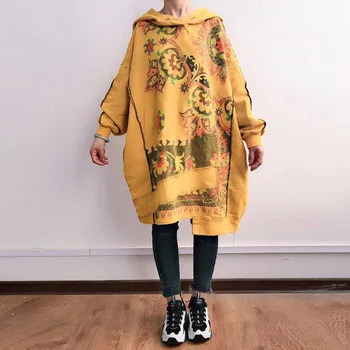 

In a spacious sweater, a woman's hat, a large size of clothes, a hood, an irregular cotton gown, a large size of jeans, a long