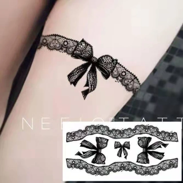 black lace bow tattoo