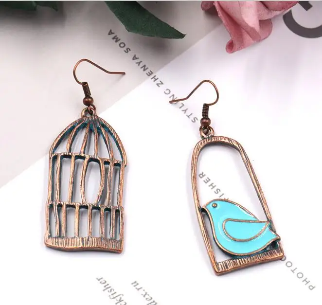 

2019 new European and American popular asymmetric alloy creative bird cage long exaggerated personality earrings