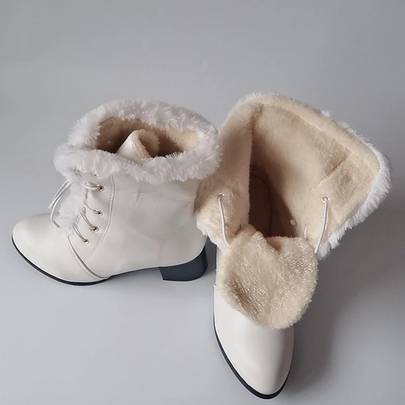 white lace up snow boots