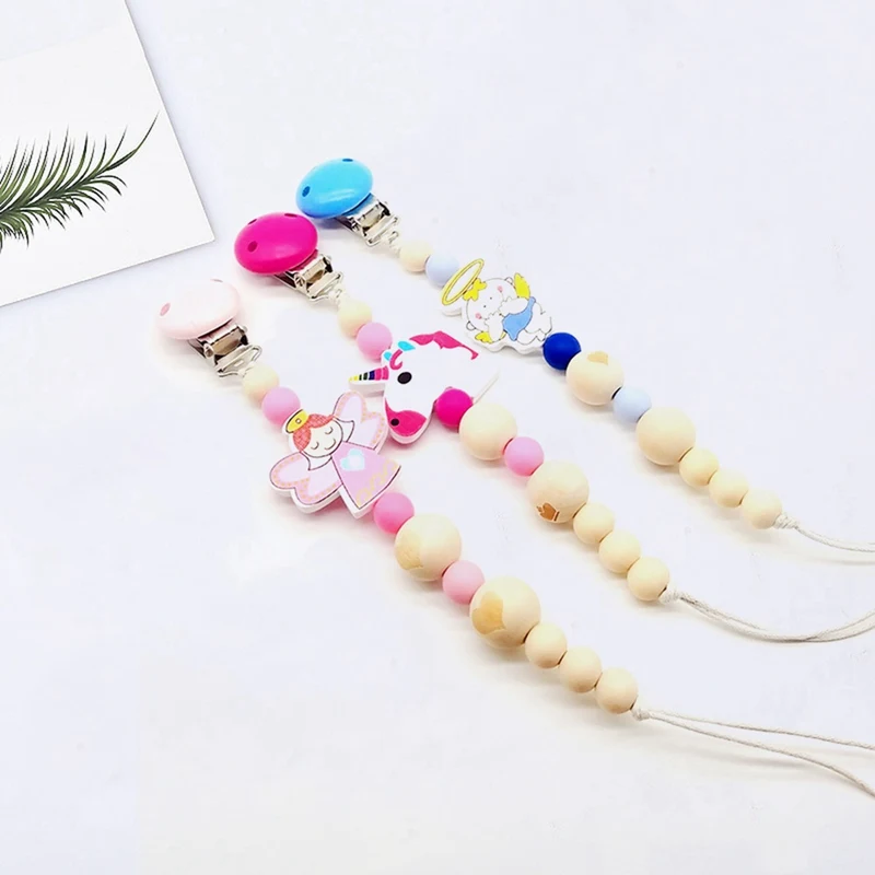 

Baby Pacifier Clip Chain Wooden Holder Soother Pacifier Clips Leash Strap Nipple Holder For Infant Feeding Fairy Unicorn Angel