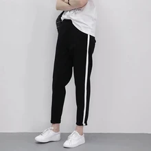 women's black track pants with white stripe
