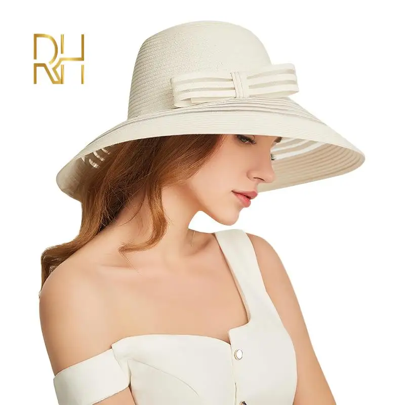 white floppy hat with black bow