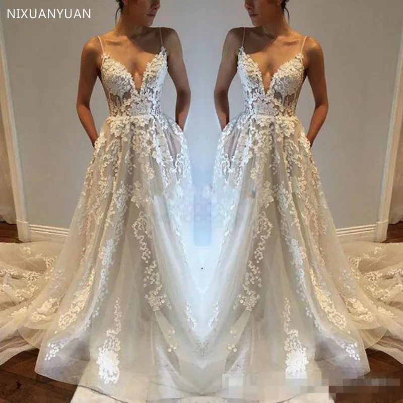 2020 Sexy Trouwjurken V-hals Geappliceerd Lace Spaghettibandjes Open Back Bruidsjurken Beach Boho Vestidos De Novia Bruid Sheer 2020 Sexy Trouwjurken V-hals Geappliceerd Lace Spaghettibandjes Open Back Bruidsjurken Beach Boho Vestidos De Novia Bruid Sheer