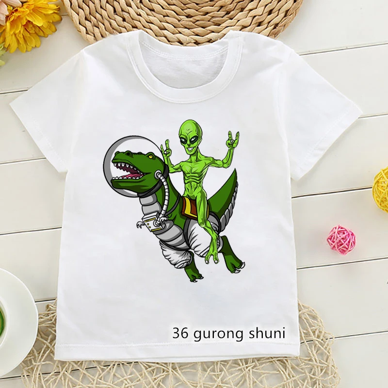 

Funny Alien Riding Dinosaur Animal Print T-Shirt Girls/Boys Kids Clothes Merry Christmas Children'S Clothing White Tshirt Tops
