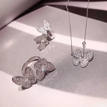 

Famous brand logo 750 jewelry 3a cubic zirconia party jewelry butterlfy clip earrings necklace pendant ring set for female gift