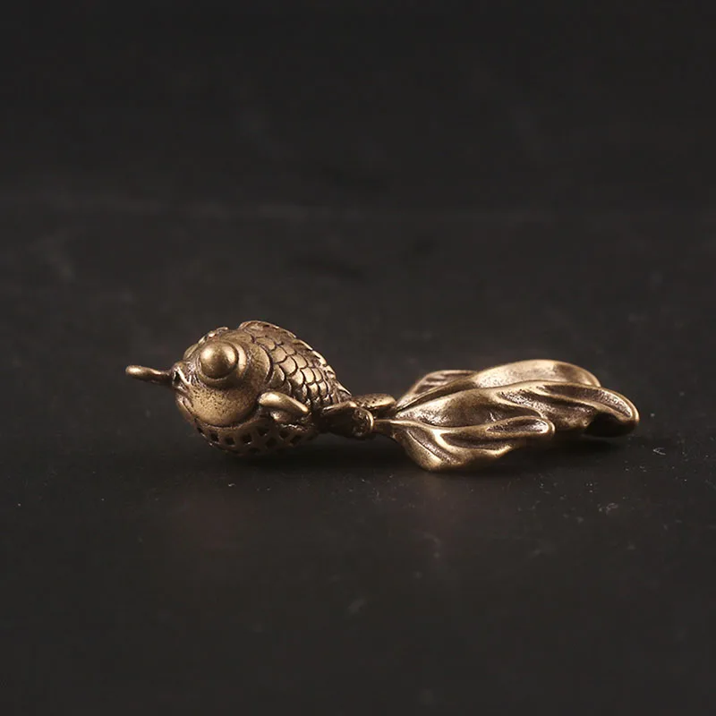 goldfish brass pendants (8)