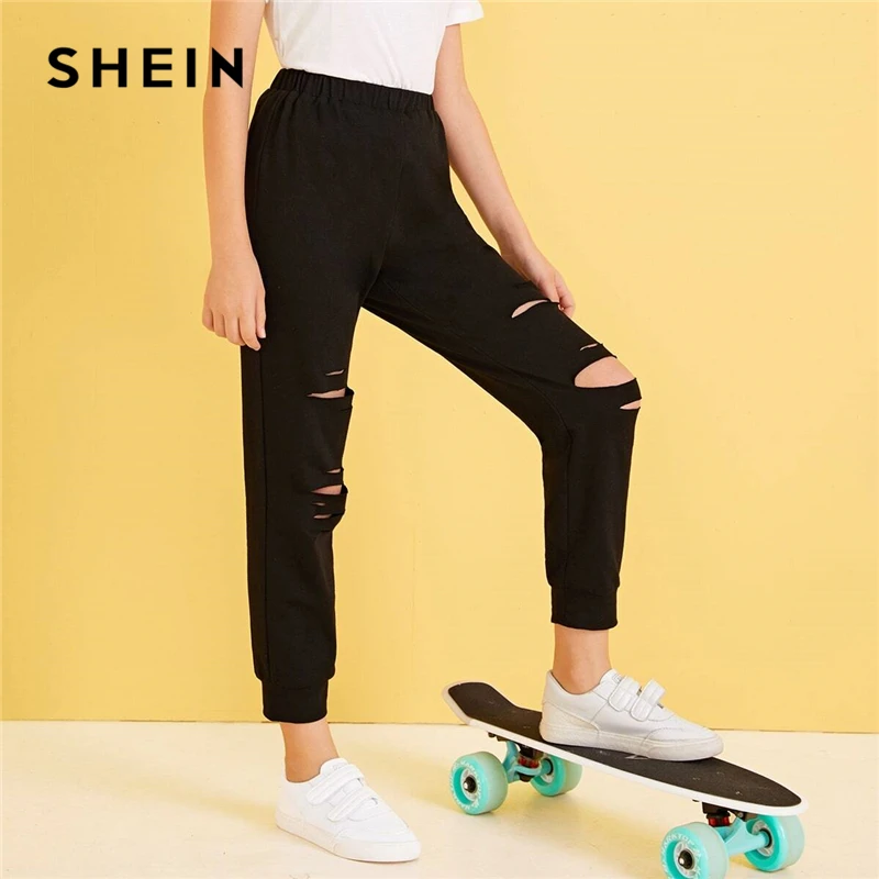 

SHEIN Kiddie Solid Ripped Cropped Casual Sweatpants Kids Bottoms 2019 Autumn Streetwear Elastic Waist Trousers For Teenagers