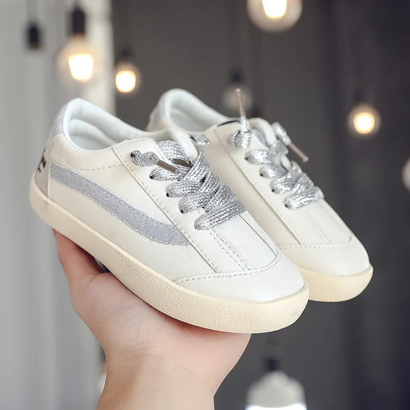 girls black and gold trainers