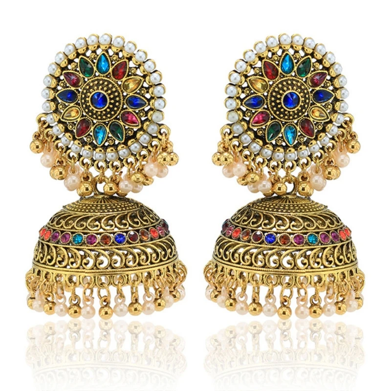 Exquisite earrings with a bohemian style, featuring ornate gold plating and charming bell accents. 