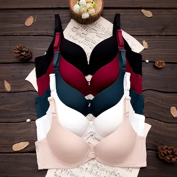 

Sexy underwear bra with steel rings on pure-color glossy surface