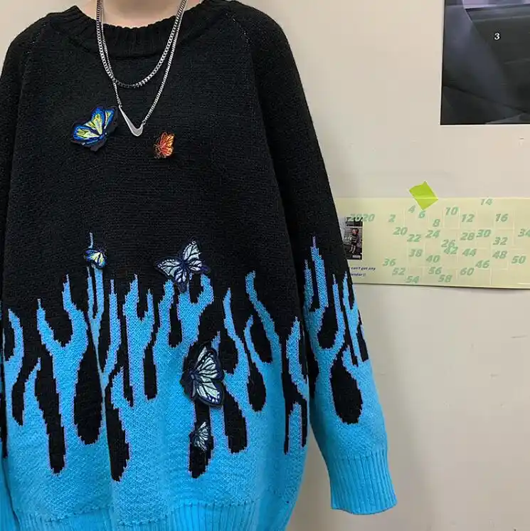 black sweater with blue flames