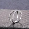 Huitan de lujo Cruz forma X las mujeres anillo de compromiso la pavimentada CZ piedra Color plata Simple elegante mujer anillo de joyería de gran oferta ► Foto 3/6