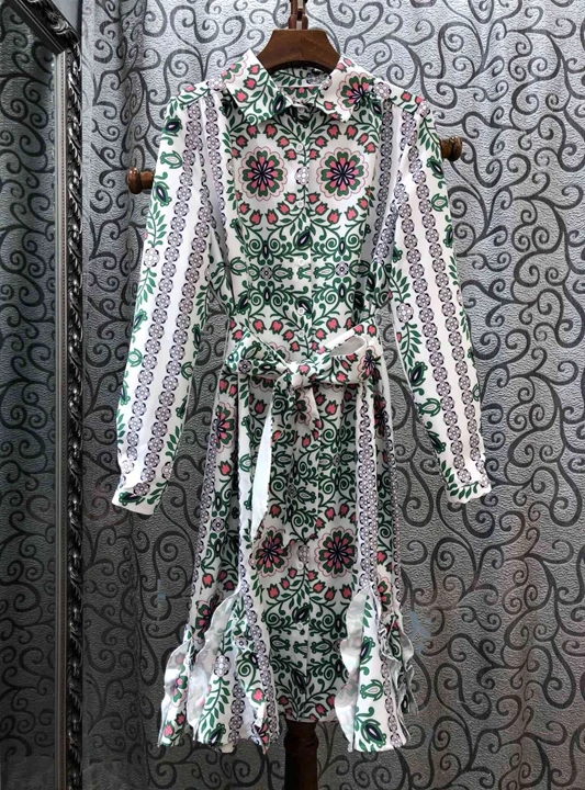 

In early autumn of 2019, the new woman's Lapel print pattern matching color tie-in waist lotus leaf pendulum dress 814