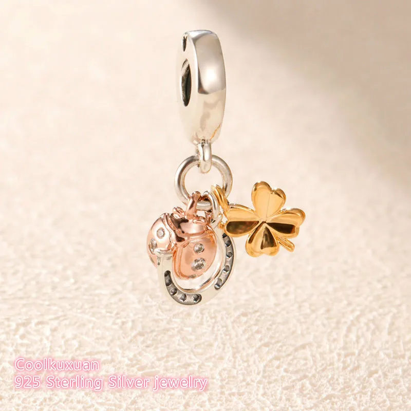 

Подвеска из серебра 100% пробы в виде подковы, клевера и божьей коровки