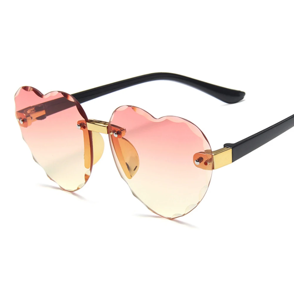 Gafas de sol con montura sin marco para niños y niñas, lentes de sol con forma de corazón, en color gris, rosa y rojo, con protección UV400, 1 unidad ► Foto 2/6