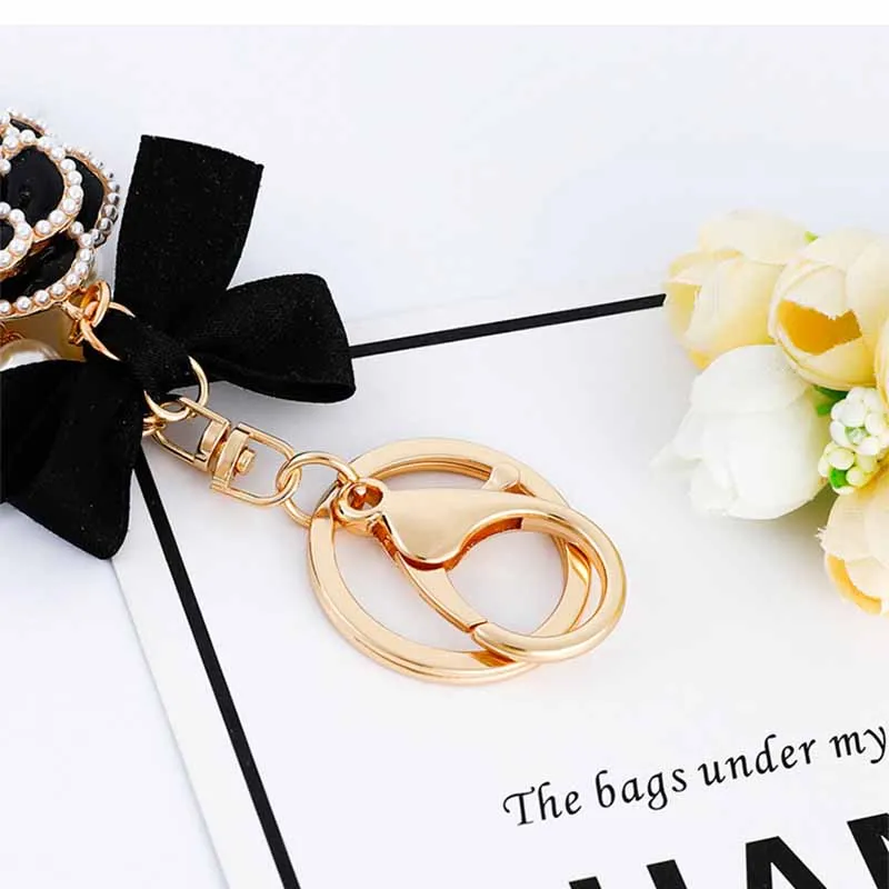 2021 Luxury Black Camellia Flower Bow Keychain Rhinestone Lock Umbrella Pendant Car Key Chain  Pendant For Bag