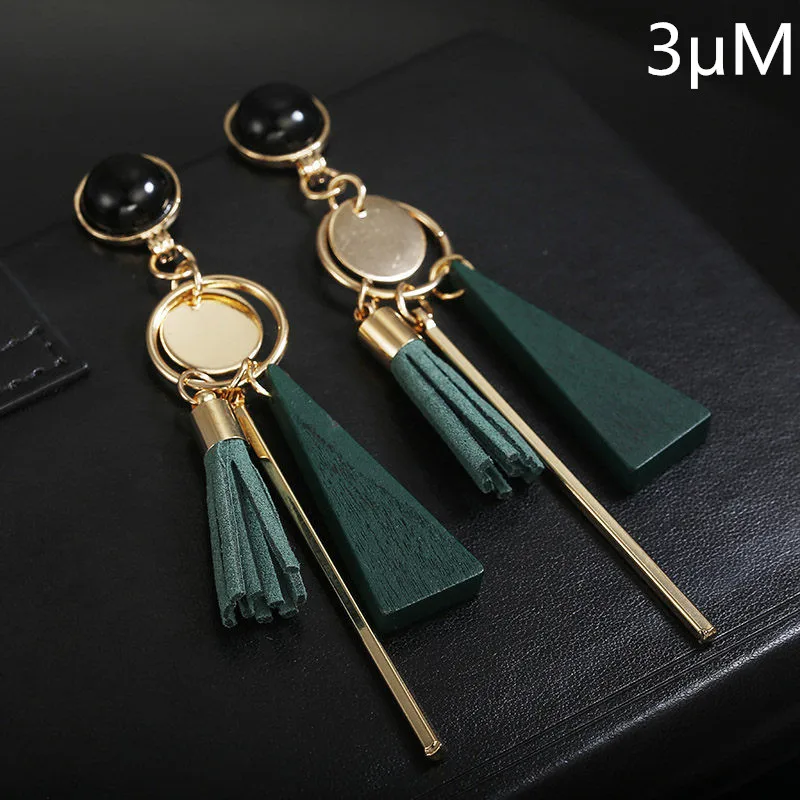

2019 Individual Character is Fashionable and Unique, Triangle Geometry Wooden Ear Ring is Worn Ancient ways Female Tassel Lon