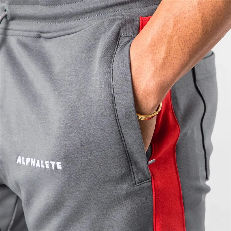 ALPHALETE, брендовые осенние бодибилдинг, повседневные брюки-карандаш, мужские обтягивающие спортивные штаны, облегающие мужские спортивные штаны, эластичные спортивные штаны в стиле пэчворк