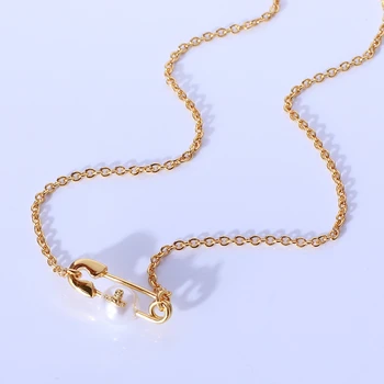 

Simple creative pin shape inlaid with pearl Saturn LOGO FASHION NECKLACE