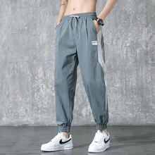 Pantalones casuales de verano para hombre, pantalones bombachos deportivos sueltos, delgados y con dobladillo, tendencia masculina