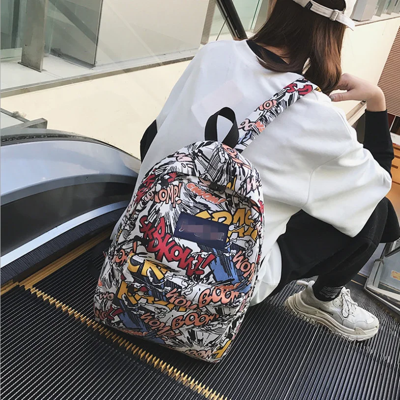 New backpack female cartoon alphabet doodle personality wild backpack men and women shoulder bag mochila