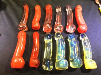 

Quartz crystal red melting hand carved massage stick. Pendant chakra