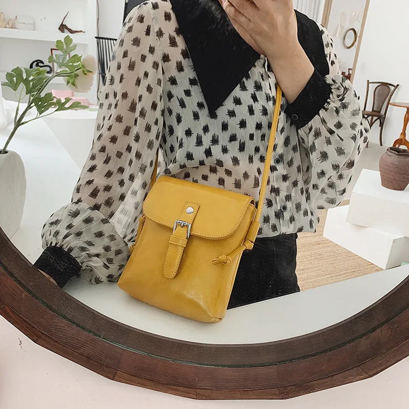 

2019 new waxed skin simple bucket bag belt decoration shoulder slung bag